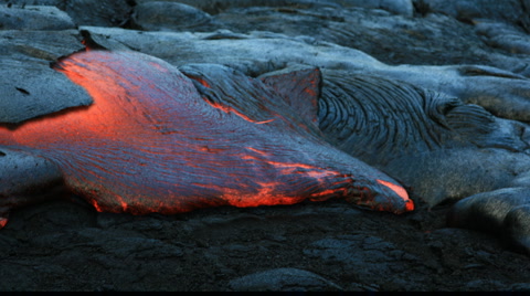 Volcanic lava vent spewing molten rock from a fissure.