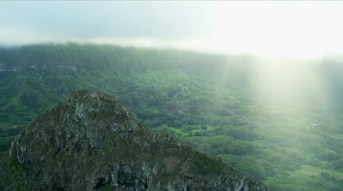 Aerial view of sun rays on volcanic cliffs, Hawaii