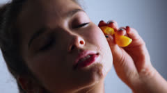 Juice on face of young model which holds fruit, closeup [45171881] | 写真素材・ストックフォトのアフロ