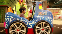 Cute Asian Boy Enjoying A Fun Ride At Carnival [140216518] | 写真素材・ストックフォトのアフロ