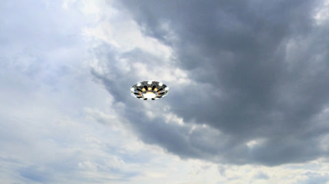 flying saucer UFO fly over in the sky