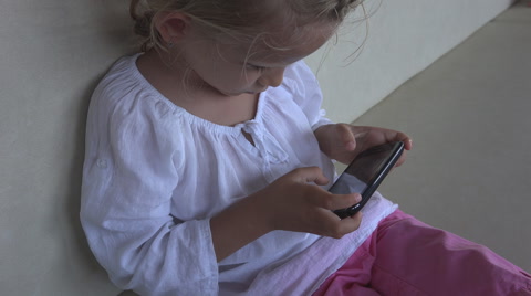 Little Girl Playing on Smartphone while Traveling, Child, Kid on Phone