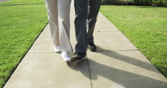 Closeup of senior couple walking on sidewalk [47710344] | 写真素材・ストックフォトのアフロ
