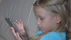 Little Girl, Child Playing Tablet, Computer, Surfing Internet, … [47766924] | 写真素材・ストックフォトのアフロ
