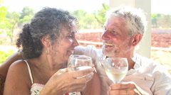 Slow Motion Shot Of Mature Couple Drinking Wine Together [48110113] | 写真素材・ストックフォトのアフロ