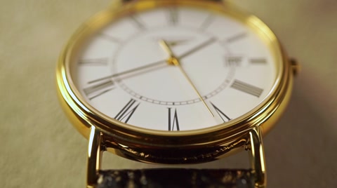 Golden classical wrist watch macro shot. Slow motion video