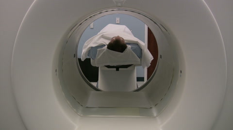 Man getting medical Pet scan done in hospital for cancer screening