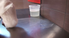 Wetting of the cleaning cloth in the wash liquor. [47795728] | 写真素材・ストックフォトのアフロ