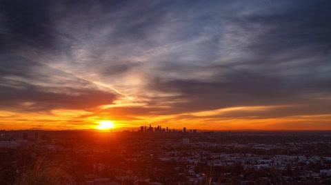 Fiery sunrise over city of Los Angeles skyline cityscape. 4K UHD timelapse.