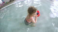 Toddler playing in kids pool at a recreational center. [139701682] | 写真素材・ストックフォトのアフロ