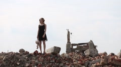 girl in a black dress with a toy bear goes on destruction of … [46838504] | 写真素材・ストックフォトのアフロ