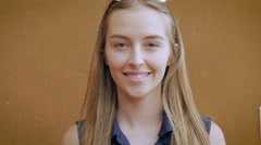 Hand held portrait of a beautiful blond wimen smiling [46567944] | 写真素材・ストックフォトのアフロ