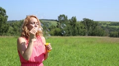 Cute young woman having fun with bubbles, she blowing bubbles [46203844] | 写真素材・ストックフォトのアフロ