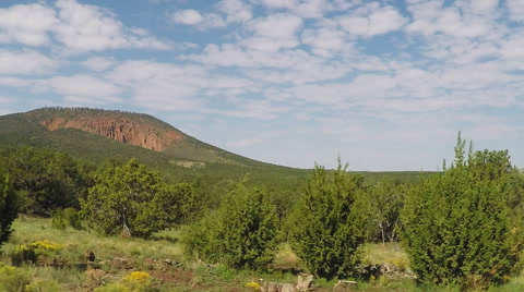 Side View Car Driving By Red Mountain Volcanic Crater- Flagstaff AZ