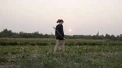 A young rural woman steps on a thorn and hurt her foot. [45965988] | 写真素材・ストックフォトのアフロ
