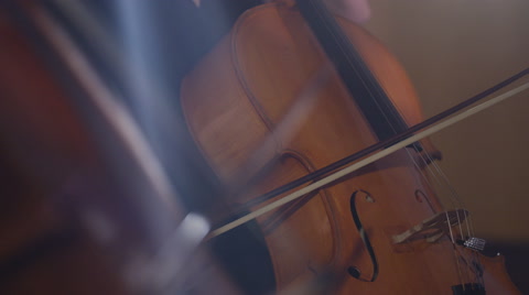 4K Close up on hands of orchestra cellist during a performance