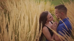 young couple kissing in a field. asian woman hugging a caucasian … [45537823] | 写真素材・ストックフォトのアフロ