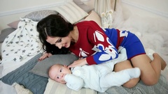 young woman stroking, hugging, caressing his young son, portrait … [45184565] | 写真素材・ストックフォトのアフロ