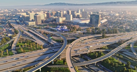 Aerial View Of San Jose City And Congested Freeway Traffic At Rush Hour