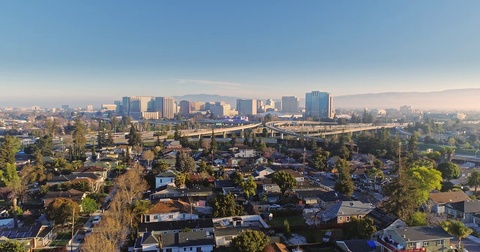 Aerial View Of San Jose City And Congested Freeway Traffic At Rush Hour