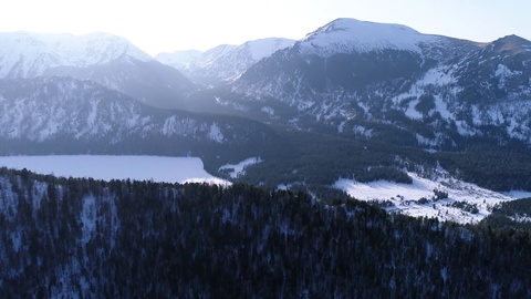 Aerial above Altai mountain valley and road at sunset