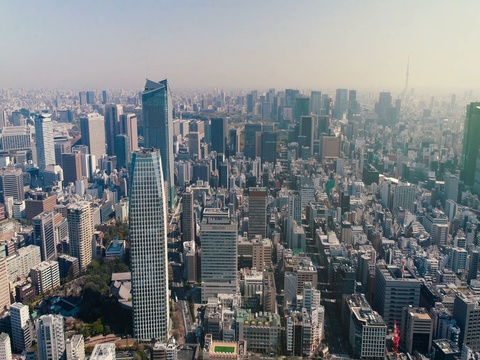 Aerial view of Tokyo skyline with morning light, Japan. Light effect applied.