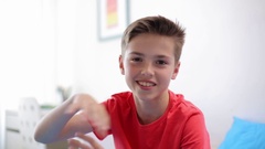 happy smiling preteen boy talking at home [138339744] | 写真素材・ストックフォトのアフロ