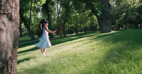 children running around in garden and laughing,slow motion