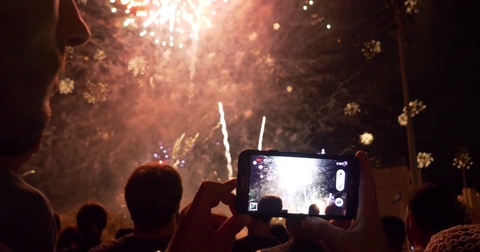 people filming Fireworks display big finale USA 4th of July New Year Celebration