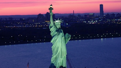 Aerial view of the Statue of Liberty at dusk.