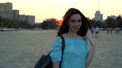 beautiful smiling brunette is standing on the street in the … [43216235] | 写真素材・ストックフォトのアフロ