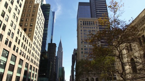 Drone establishing shot of skyscrapers buildings street in NYC New York City NY