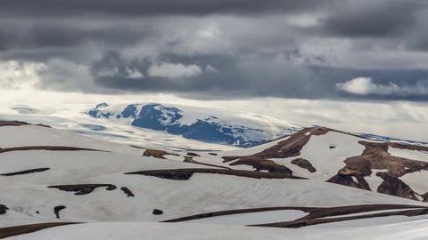 Dramatic clouds moving over winter volcanic mountains of katla in Iceland