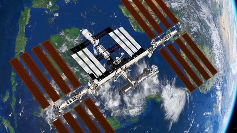 International Space Station ISS revolving over earths atmosphere ...