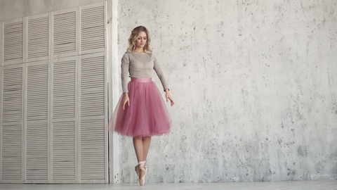 ballet dancer spinning on her toes in Pointe shoes and classical tutu. ballerina