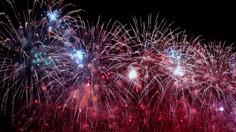 Colorful fireworks exploding in the night sky. Celebrations and events in bri