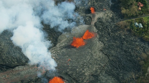 Aerial of volcanic magma destroying landscape Kilauea Hawaii