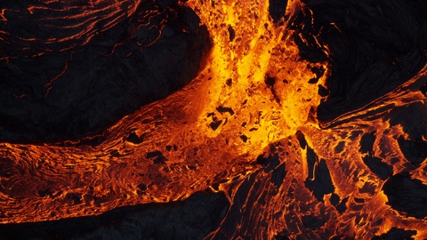 Aerial earth view of liquid volcanic lava flowing