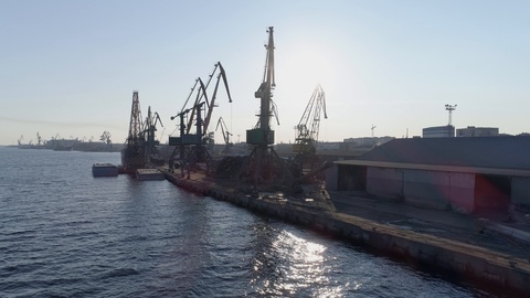 aerial view city trade port with recyclable materials, cranes and cargo ship