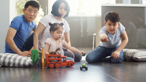 Asian Parents and Children Playing Together