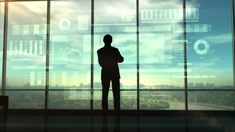 Silhouette of a trader in the office before infographics