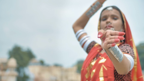 Beautiful classical Indian dancer dancing in traditional attire.