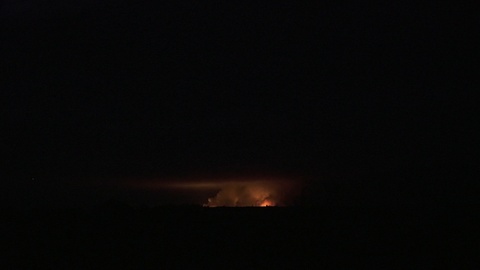 Brightest light caused by the explosion comes out of the smoke, aerial shot