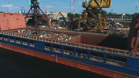 aerial View on trading seaport with cranes, cargoes and the ship