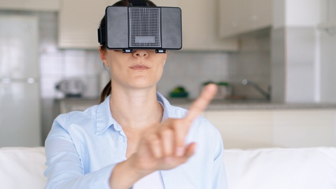 Woman in VR 360 glasses make gestures with hands. Female using virtual reality