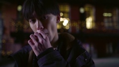 arrogant young asian teen boy is smoking outdoors in city, … [134292324] | 写真素材・ストックフォトのアフロ