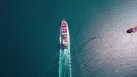 Aerial footage of ultra large container ship at sea, top down view