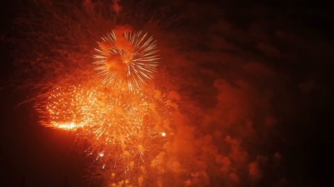 Fireworks or salut. Multi Colored explosions and smoke in night sky. Symbol of