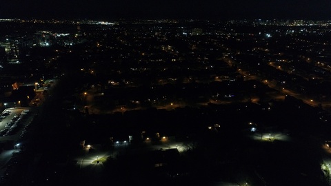 Flying Over City Lights Residential Neighborhood At Night Aerial View