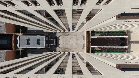 Psychedelic mirror effect on the footage of industrial alpinists on the building